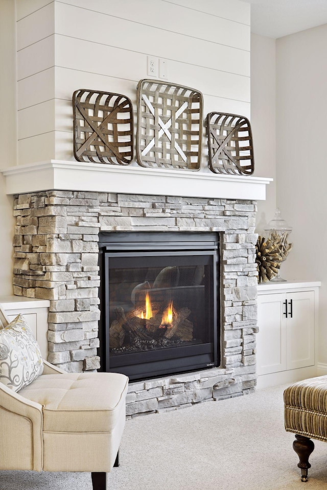 room details featuring carpet floors and a fireplace