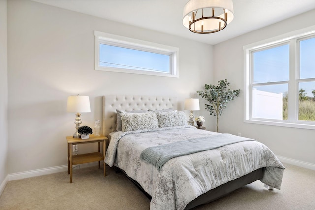 bedroom featuring carpet and baseboards