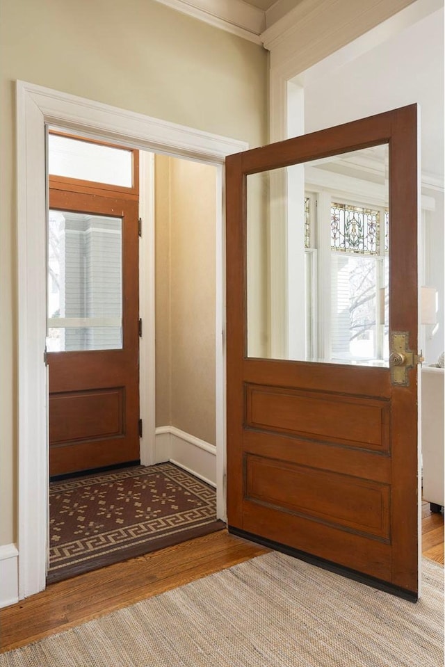 foyer entrance featuring light wood-style flooring