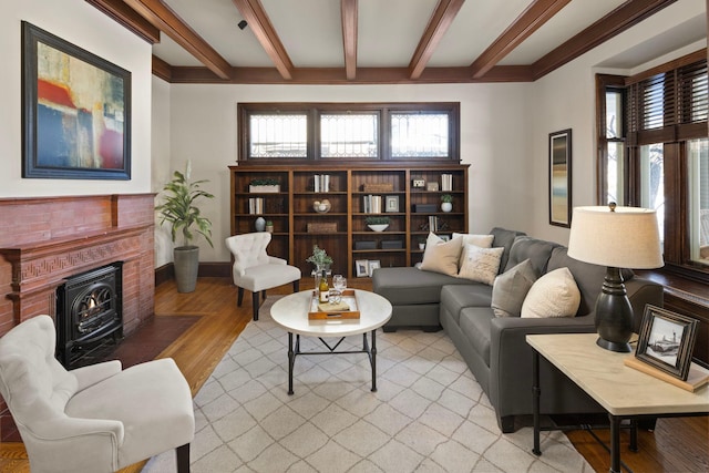 living area featuring light wood-type flooring, plenty of natural light, baseboards, and beamed ceiling