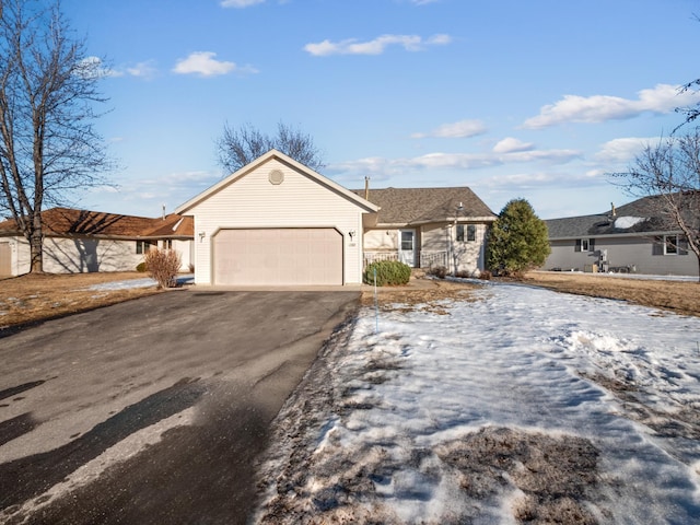 ranch-style home with a garage