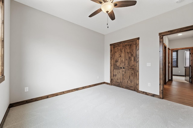 unfurnished bedroom featuring ceiling fan and carpet floors