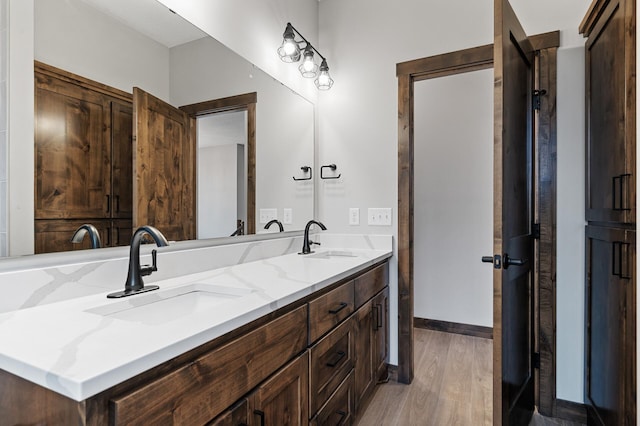 bathroom with vanity and hardwood / wood-style floors