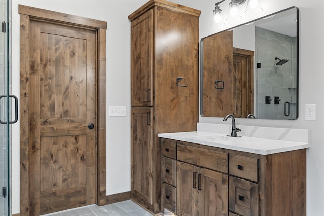 bathroom with walk in shower and vanity