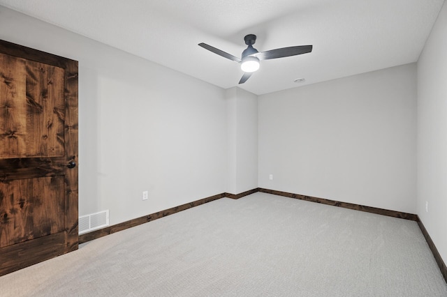 unfurnished room featuring carpet floors and ceiling fan