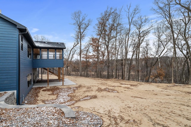 view of yard with a sunroom