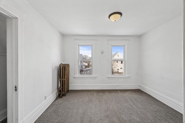 818 Sherburne Ave, Saint Paul, MN 55104 - carpeted spare room with radiator heating unit and baseboards