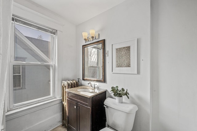 818 Sherburne Ave, Saint Paul, MN 55104 - bathroom with vanity, toilet, and a chandelier