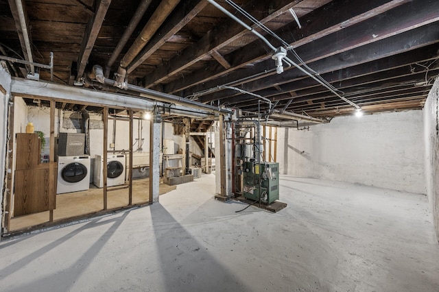 818 Sherburne Ave, Saint Paul, MN 55104 - unfinished below grade area featuring separate washer and dryer and a heating unit