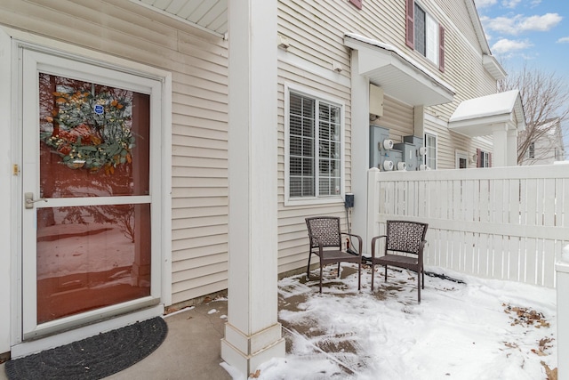 view of snow covered property entrance