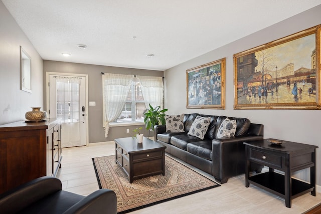 living room featuring baseboards