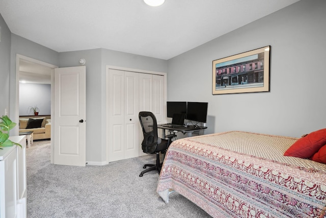 bedroom with a closet, baseboards, and carpet flooring