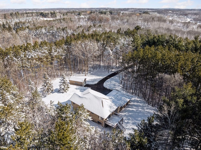 drone / aerial view featuring a forest view