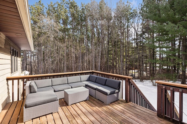 wooden terrace featuring an outdoor living space