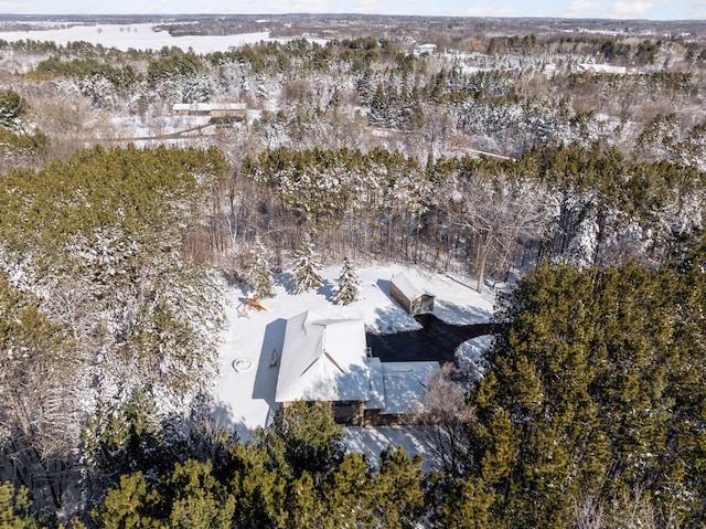 bird's eye view featuring a wooded view