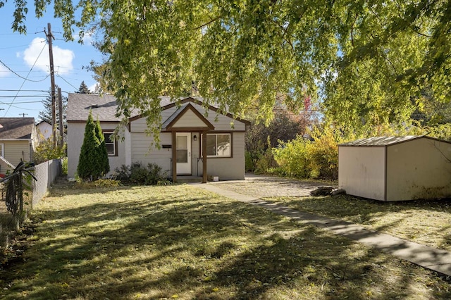 exterior space with a storage unit and a lawn