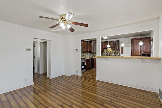 unfurnished living room featuring dark hardwood / wood-style floors and ceiling fan