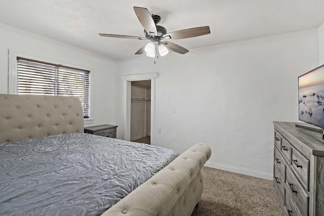 bedroom featuring ceiling fan, carpet floors, and a closet