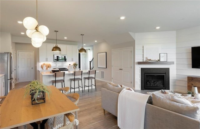 living room with light hardwood / wood-style floors