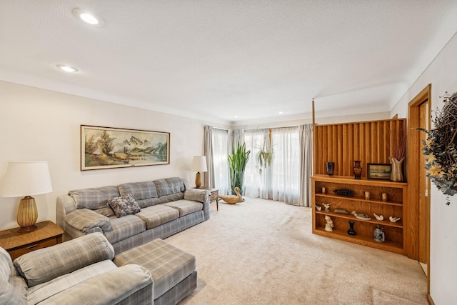 living area featuring carpet floors and recessed lighting