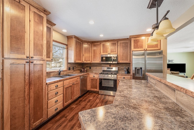 kitchen featuring tasteful backsplash, sink, dark wood-type flooring, and stainless steel appliances