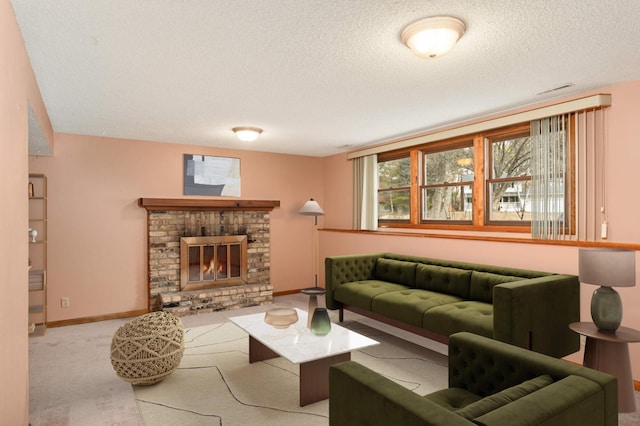 living room featuring carpet flooring, a fireplace, a textured ceiling, and baseboards