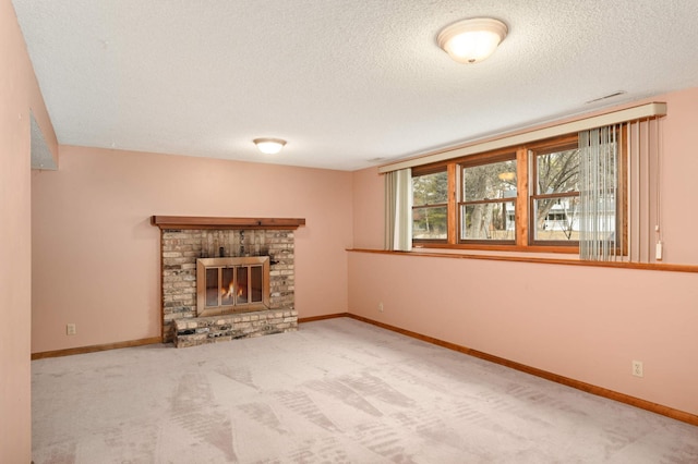 unfurnished living room with a fireplace, carpet flooring, and baseboards