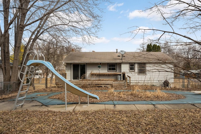 rear view of property with fence