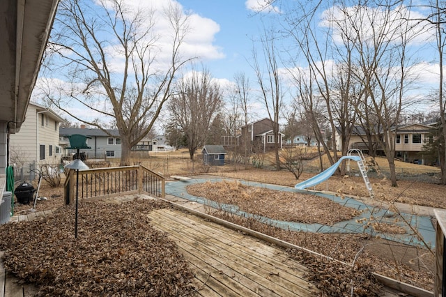 view of yard featuring fence and a residential view