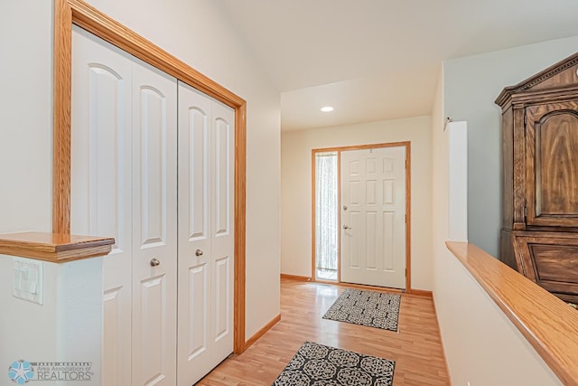 entrance foyer with light wood finished floors, recessed lighting, and baseboards