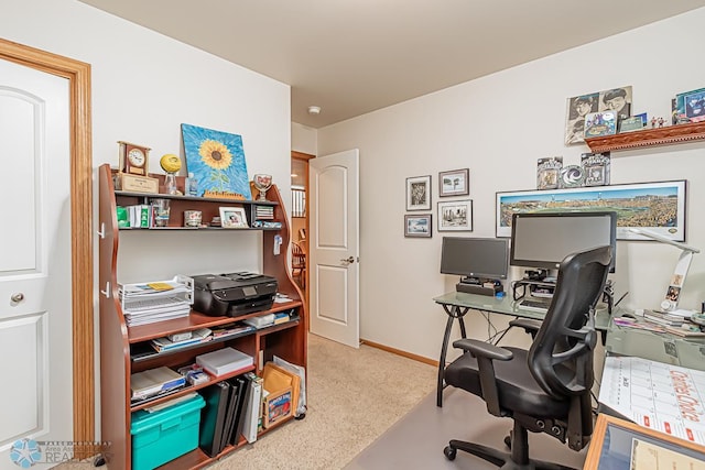 home office featuring light colored carpet and baseboards