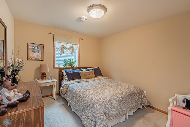 bedroom featuring visible vents, baseboards, and light colored carpet