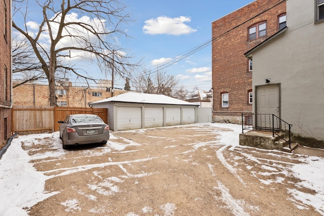 exterior space featuring a garage and an outdoor structure