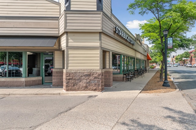 exterior space with stone siding