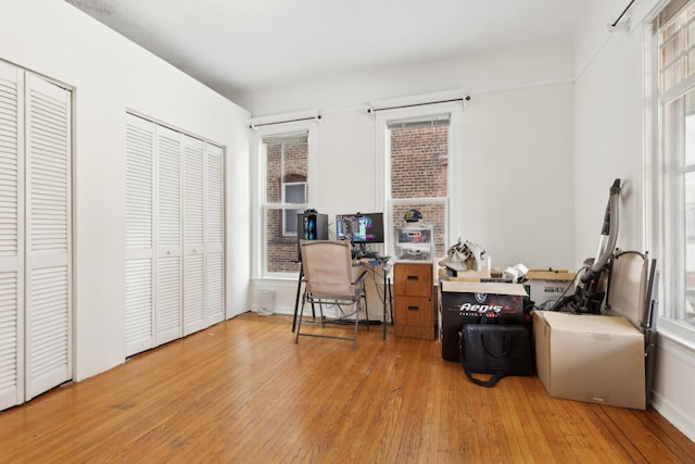 office featuring baseboards and hardwood / wood-style flooring
