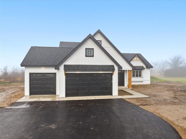 modern farmhouse style home with a garage