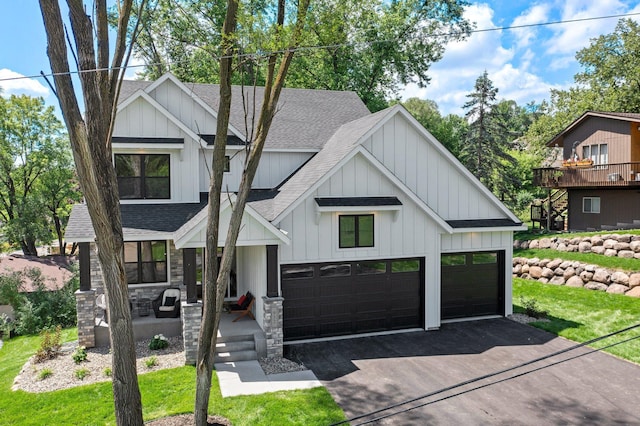 932 Orchard Ln, Roseville, MN 55113 - modern inspired farmhouse featuring a shingled roof, board and batten siding, and driveway