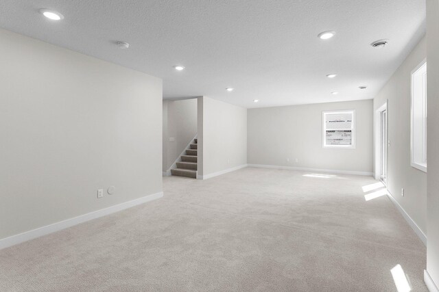 932 Orchard Ln, Roseville, MN 55113 - unfurnished room featuring light colored carpet, stairs, recessed lighting, and a smoke detector