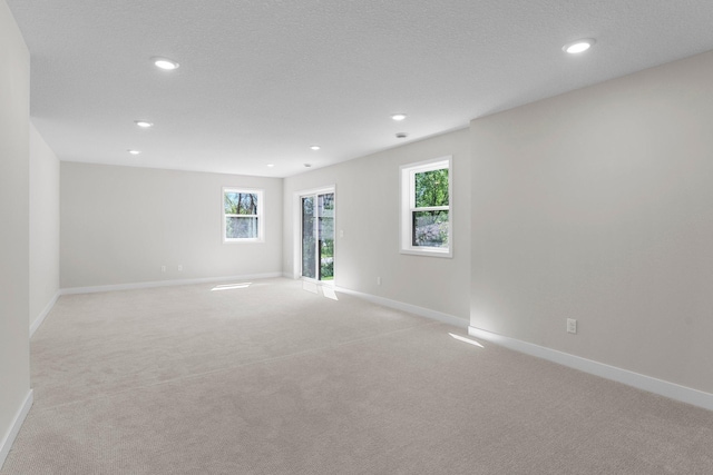 932 Orchard Ln, Roseville, MN 55113 - unfurnished room with recessed lighting and light colored carpet