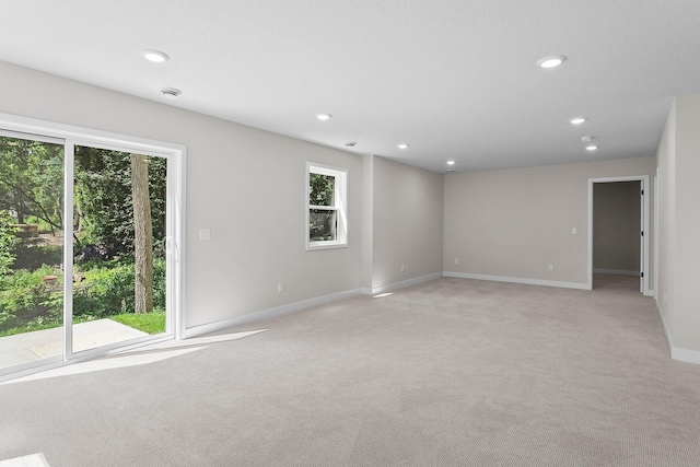 932 Orchard Ln, Roseville, MN 55113 - empty room featuring light carpet, plenty of natural light, recessed lighting, and a smoke detector