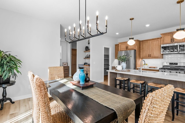 932 Orchard Ln, Roseville, MN 55113 - dining area featuring light wood-style floors, recessed lighting, and a chandelier