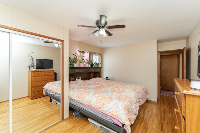 bedroom with wood-type flooring and ceiling fan