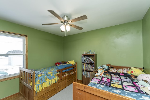 bedroom with ceiling fan and carpet floors