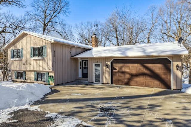 split level home with a garage