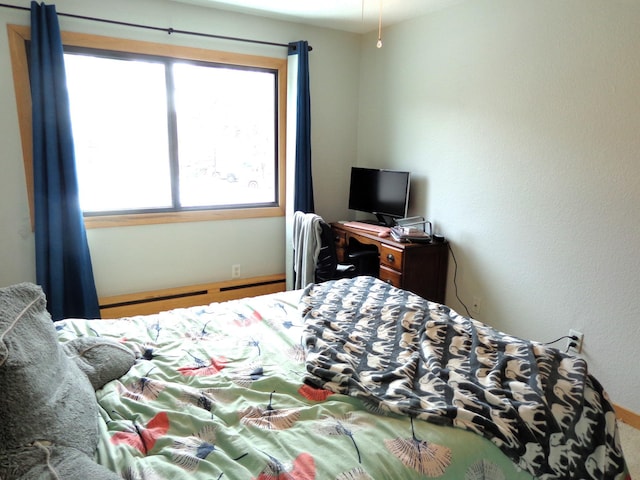 bedroom with a baseboard radiator