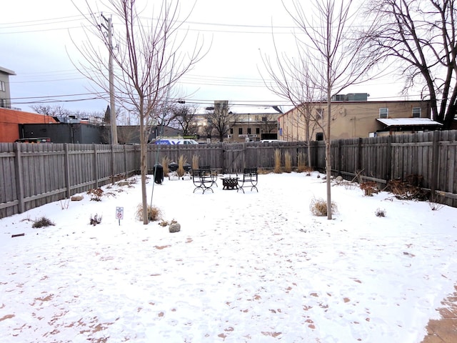 view of yard covered in snow