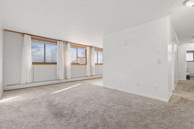 unfurnished room with light carpet, plenty of natural light, and baseboard heating