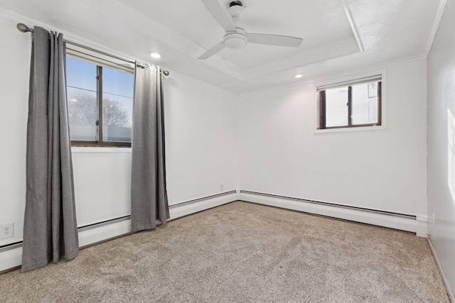 spare room featuring light carpet, baseboard heating, ornamental molding, a raised ceiling, and ceiling fan