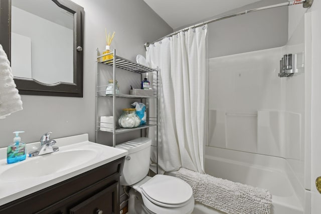 full bathroom with vanity, shower / bath combination with curtain, and toilet