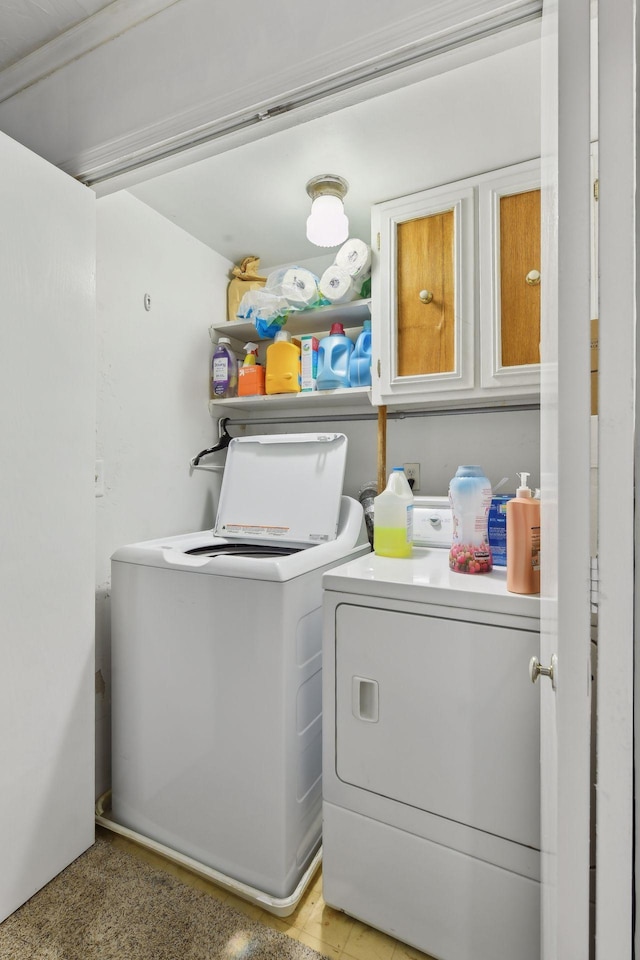 clothes washing area featuring washer and dryer